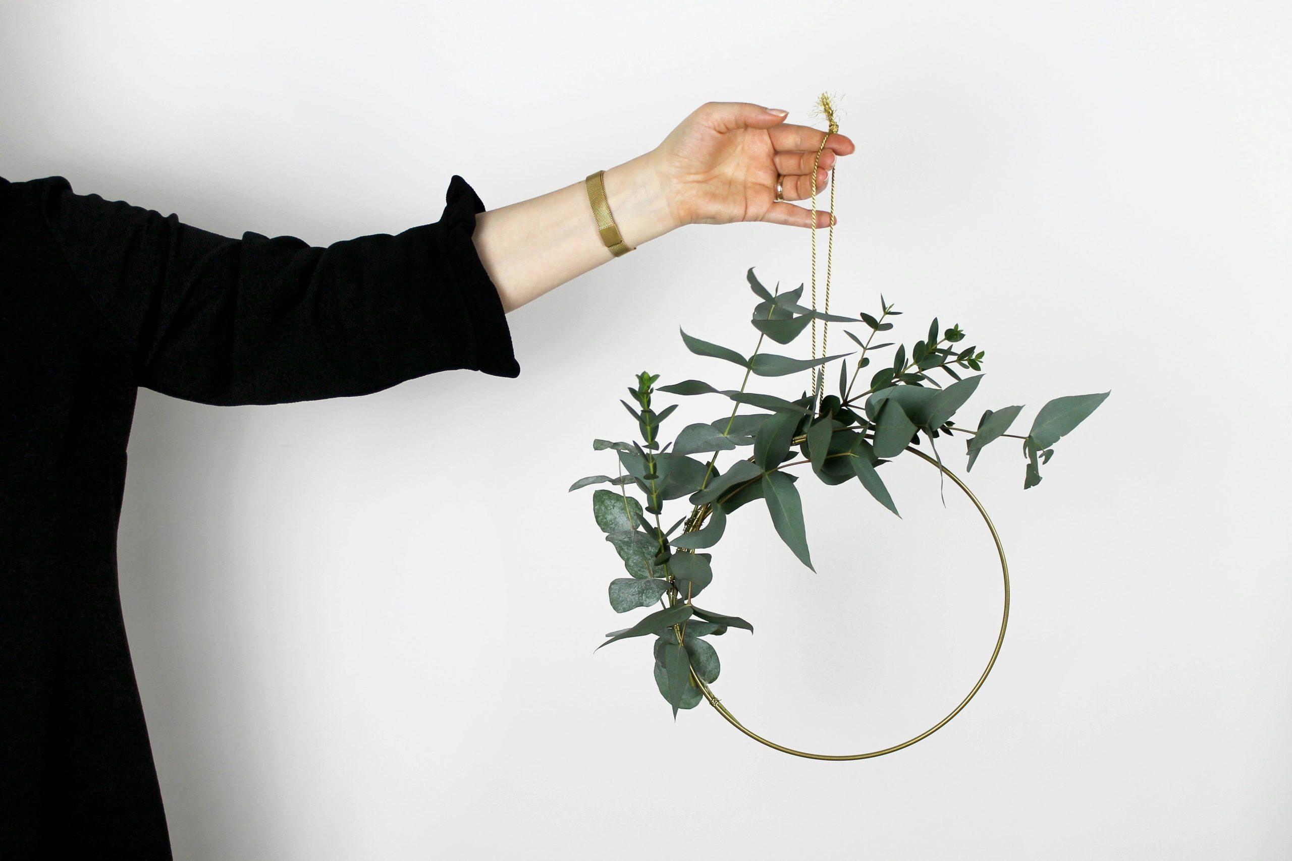 Green garland decor with dried flowers.