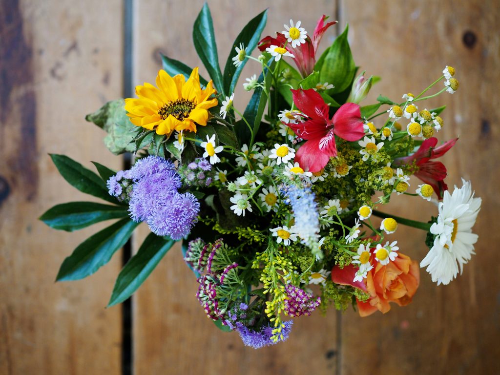 An artificial bouquet of flowers in a vase.