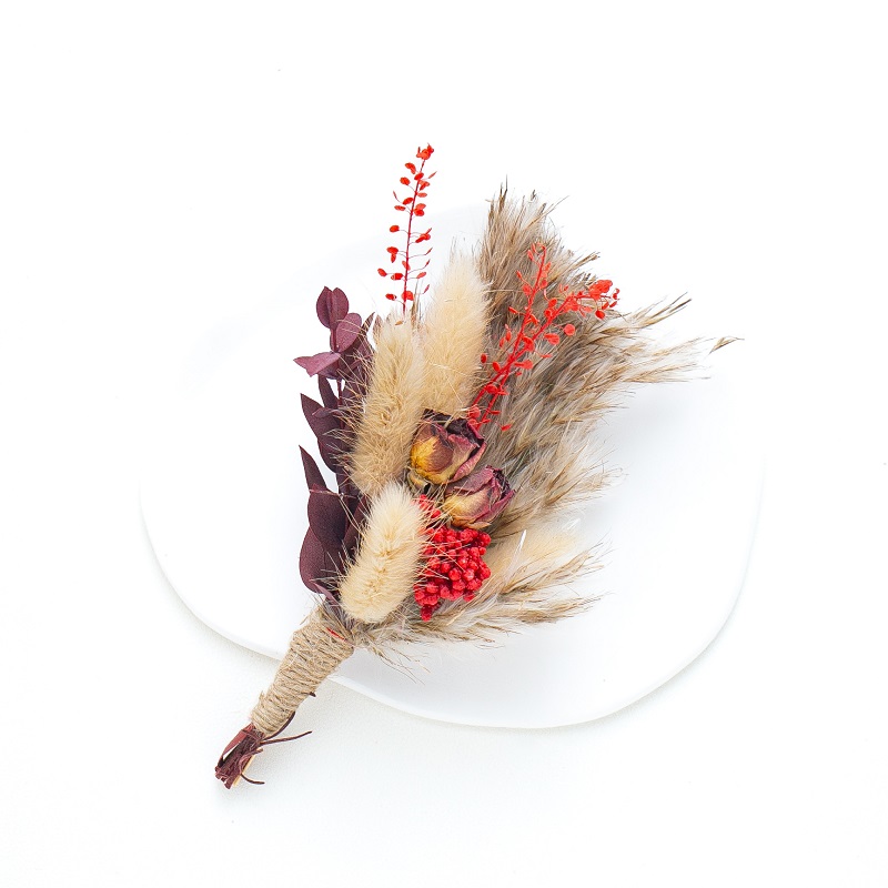 brown and red bunny tail buttonhole